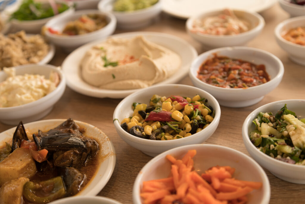 קייטרינג לשבת חתן - Close Up View of Various White Bowls of an Arab Salad